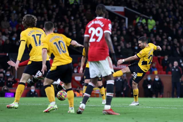 Joao Moutinho of Wolverhampton Wanderers scores their side's first goal during the Premier League match between Manchester United and Wolverhampton Wanderers at Old Trafford 