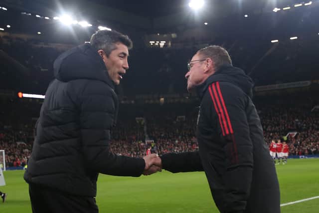 Interim Manager Ralf Rangnick of Manchester United greets Manager Bruno Lage of Wolverhampton Wanderers ahead of the Premier League match between Manchester United and Wolverhampton Wanderers at Old Trafford