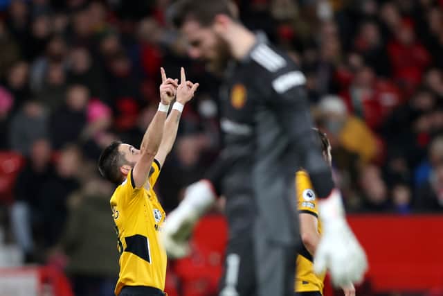 Joao Moutinho of Wolverhampton Wanderers celebrates after scoring their side's first goal during the Premier League match between Manchester United and Wolverhampton Wanderers at Old Trafford