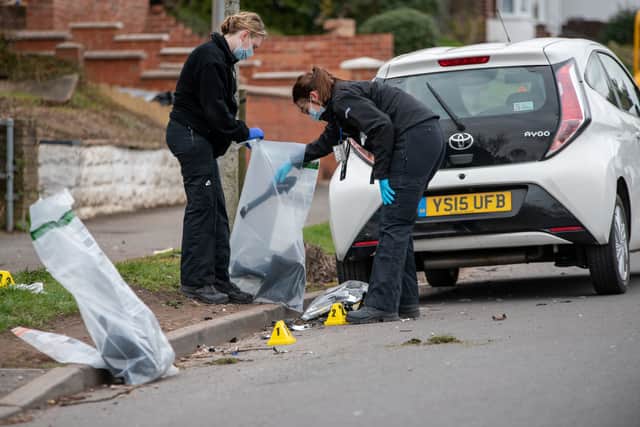 Police officers collecting pieces of the wreckage and gathering evidence at the scene on Rocky Lane in Perry Barr, Birmingham, where Liam Mooney was killed