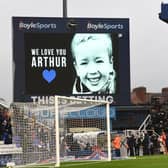 The TV screen shows a tribute to Arthur Labinjo-Hughes prior to the Sky Bet Championship match between Birmingham City and Cardiff City at St Andrew’s Trillion Trophy Stadium on December 11, 2021 (Tony Marshall/Getty Images)
