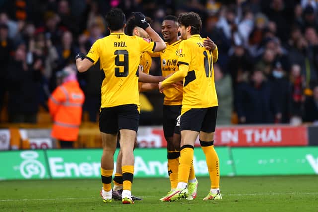 Nelson Semedo of Wolverhampton Wanderers celebrates with teammates Francisco Trincao, Rayan Ait-Nouri and Raul Jimenez after scoring their team's second goal during the Emirates FA Cup Third Round match between Wolverhampton Wanderers and Sheffield United