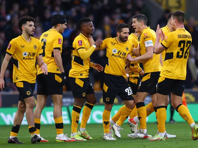 Nelson Semedo of Wolverhampton Wanderers celebrates with teammates after scoring their team's second goal during the Emirates FA Cup Third Round match between Wolverhampton Wanderers and Sheffield United at Molineux