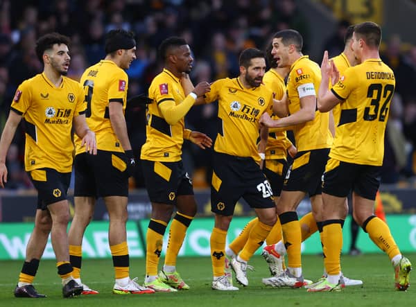 Nelson Semedo of Wolverhampton Wanderers celebrates with teammates after scoring their team's second goal during the Emirates FA Cup Third Round match between Wolverhampton Wanderers and Sheffield United at Molineux