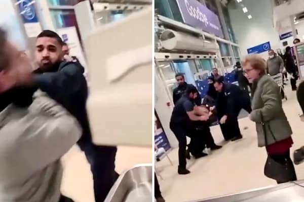 Shocking footage shows the moment a mass brawl broke out inside the Tesco superstore in Aston while a fearless pensioner casually continued her shopping