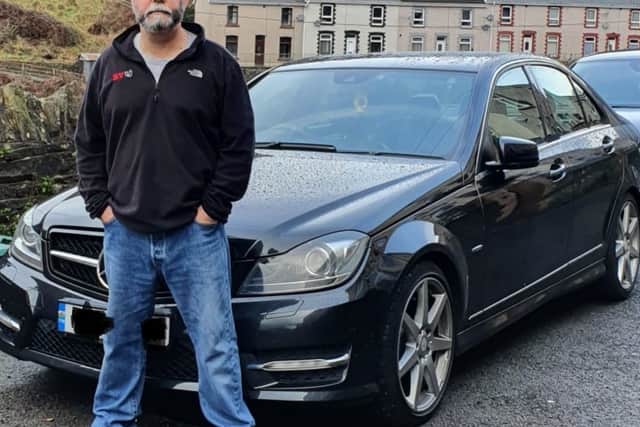 Sean Alabaster with his car after receiving a Birmingham CAZ fine for non-payment
