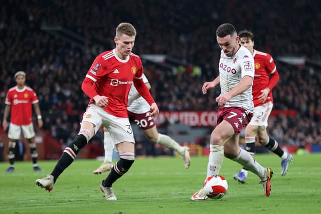 John McGinn of Aston Villa takes on McTominay during the Emirates FA Cup Third Round match between Manchester United and Aston Villa at Old Trafford 