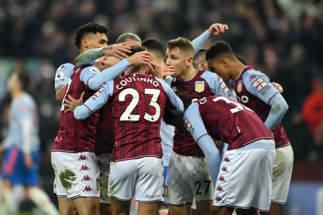 Philippe Coutinho of Aston Villa celebrates with Lucas Digne and teammates after scoring their side's second goal  during the Premier League match between Aston Villa and Manchester United at Villa Park 