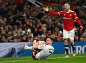 John McGinn of Aston Villa reacts to a tackle from Luke Shaw of Manchester United  during the Emirates FA Cup Third Round match between Manchester United and Aston Villa at Old Trafford 