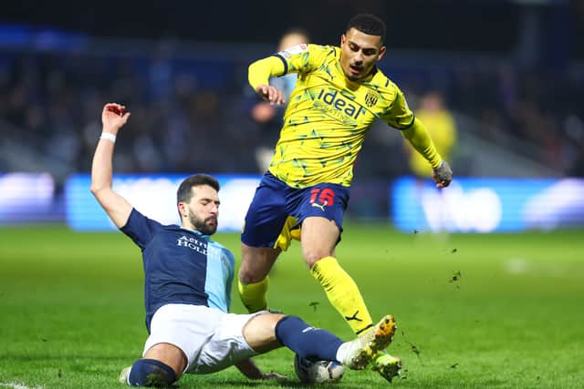 Yoann Barbet of Queens Park Rangers challenges Karlan Grant of West Bromwich Albion during the Sky Bet Championship match between Queens Park Rangers and West Bromwich Albion at The Kiyan Prince Foundation Stadium