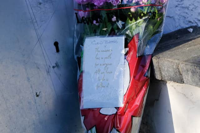 Floral tributes at the boarded up house on Gravelly Lane in Erdington, Birmingham