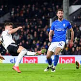 Tom Cairney of Fulham (L) scores their team's fourth goal during the Sky Bet Championship match between Fulham and Birmingham City