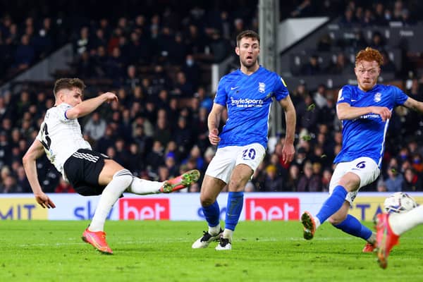Tom Cairney of Fulham (L) scores their team's fourth goal during the Sky Bet Championship match between Fulham and Birmingham City
