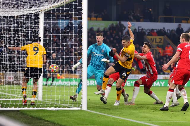 Conor Coady of Wolverhampton Wanderers scores their team's second goal during the Premier League match between Wolverhampton Wanderers and Southampton at Molineux on January 15, 2022 in Wolverhampton, England.