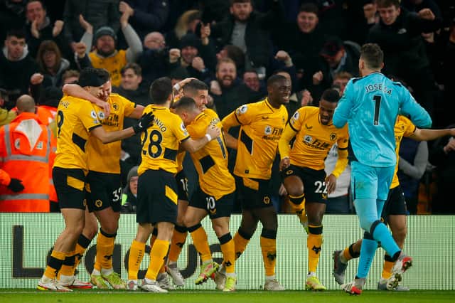 Players from Wolverhampton Wanderers celebrate following a goal scored by Conor Coady during the Premier League match between Wolverhampton Wanderers and Southampton at Molineux on January 15, 2022 in Wolverhampton, England