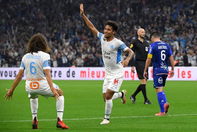 Marseille’s French defender Boubacar Kamara (R) celebrates scoring his team’s first goal with Marseille’s French defender Matteo Guendouzi (L) during the French L1 football match between Olympique de Marseille (OM) and FC Lorient at Stade Velodrome in Marseille, southern France on October 17, 2021.