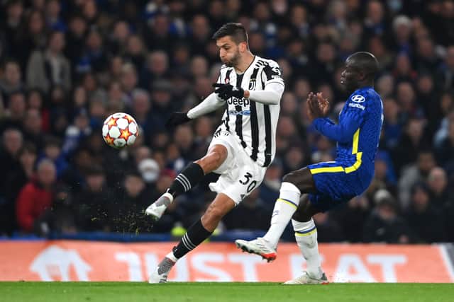 Rodrigo Bentancur of Juventus is challenged by Ngolo Kante of Chelsea during the UEFA Champions League group H match between Chelsea FC and Juventus at Stamford Bridge on November 23, 2021 in London, England.