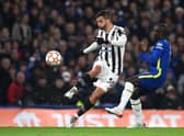 Rodrigo Bentancur of Juventus is challenged by Ngolo Kante of Chelsea during the UEFA Champions League group H match between Chelsea FC and Juventus at Stamford Bridge on November 23, 2021 in London, England.