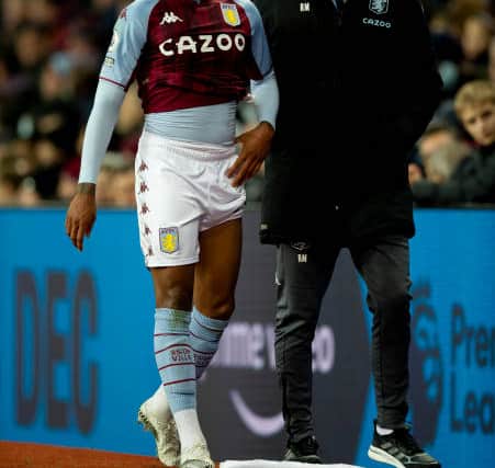 Leon Bailey limping off injured against Manchester City. Picture: Neville Williams/Aston Villa FC via Getty Images.