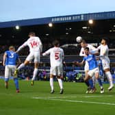 Lukas Jutkiewicz of Birmingham City challenges for the ball with Romal Palmer and Michal Helik of Barnsley during the Sky Bet Championship match between Birmingham City and Barnsley
