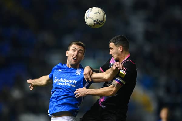 Gary Gardner of Birmingham City jumps fir the ball with Oliver Norburn of Peterborough United during the Sky Bet Championship match between Birmingham City and Peterborough United