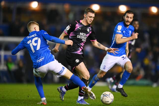 Jack Taylor of Peterborough United battles for the ball with Jordan James and Ivan Sunjic of Birmingham City during the Sky Bet Championship match between Birmingham City and Peterborough United