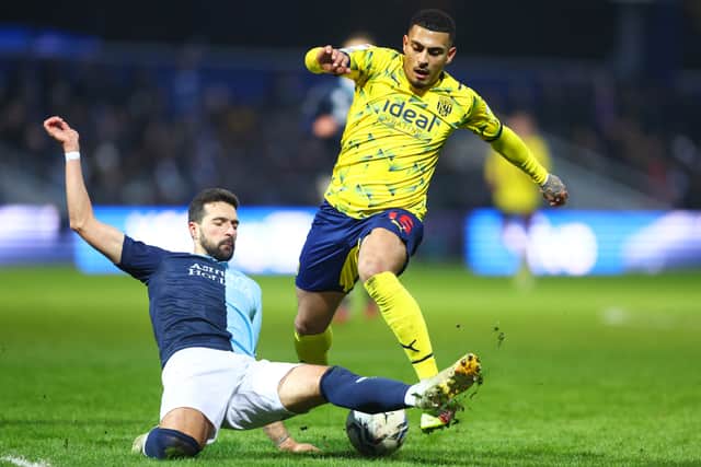 Yoann Barbet of Queens Park Rangers challenges Karlan Grant of West Bromwich Albion during the Sky Bet Championship match between Queens Park Rangers and West Bromwich Albion