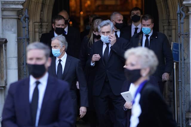 Former prime ministers Tony Blair (left) and Gordon Brown (centre) leave the funeral service of Labour MP Jack Dromey at St Margaret's Church in Westminster, London. Picture date: Wednesday January 26, 2022.