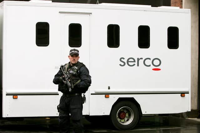 Armed police officers guards the entrance to Westminster Magistrates court after the arrival of a police truck believed to be carrying Parviz Khan, 36, in 2009 (Photo by Bruno Vincent/Getty Images)
