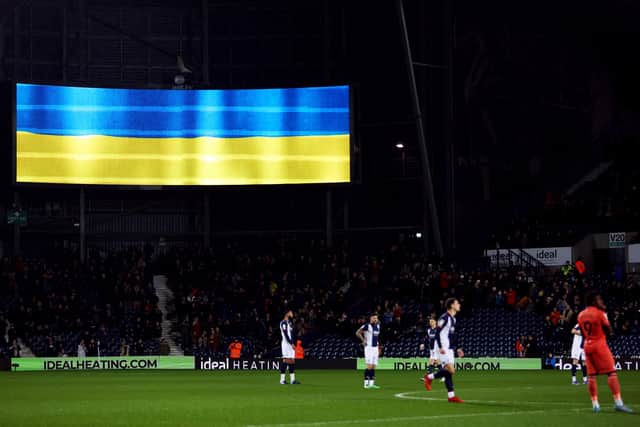 An LED board shows the Ukrainian flag prior to the Sky Bet Championship match between West Bromwich Albion and Swansea City at The Hawthorns