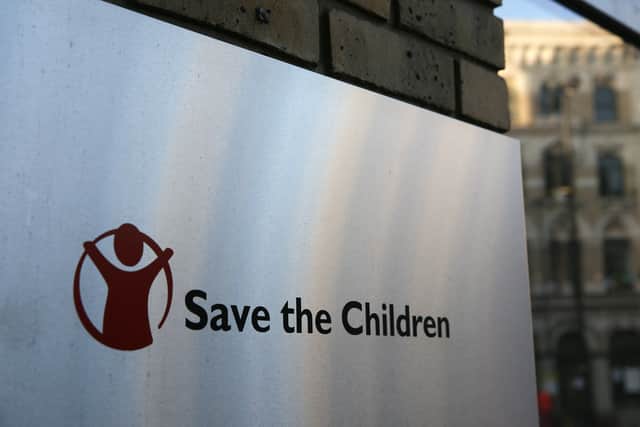 A Save the Children logo is seen outside the organisation's offices in central London on February 15, 2018