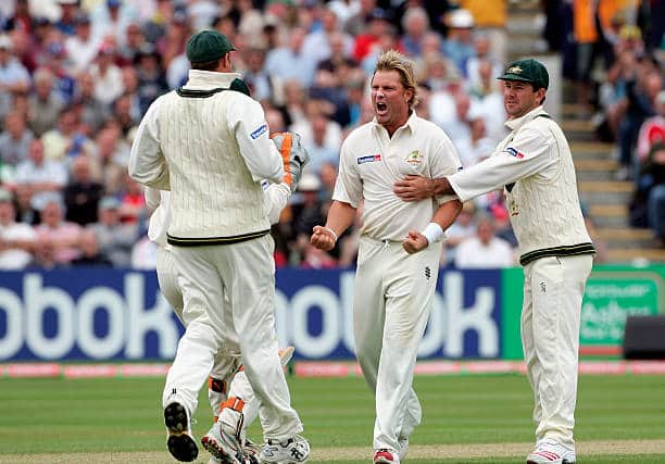 Shane Warne is congratulated by Ricky Ponting and team-mates after taking the wicket of Ashley Giles at Edgbaston in 2005. Picture: Tom Shaw/Getty Images.
