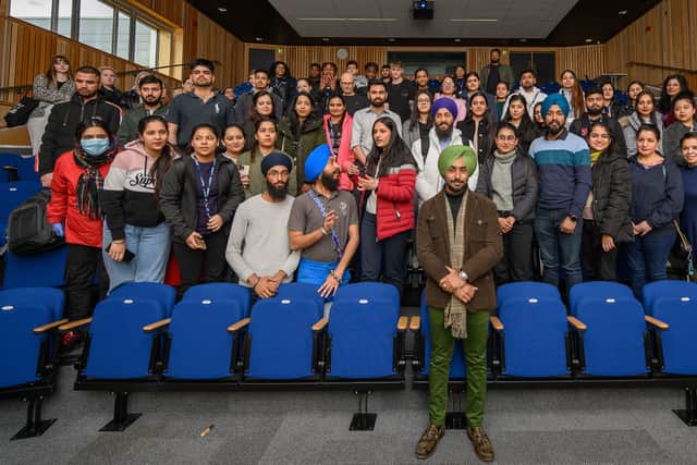Satinder Sartaaj with staff and students from Birmingham City University