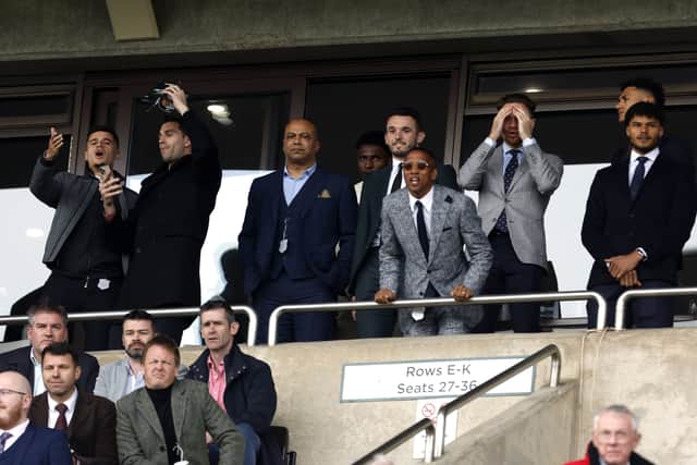 Villa players, Philippe Coutinho, Emiliano Martinez, John McGinn, Ashley Young, Matty Cash, Ollie Watkins and Tyrone Mings watch the action from the stands on day one of the Cheltenham Festival at Cheltenham Racecourse.