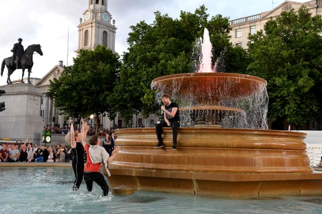 Ricky Wilson of the Kaiser Chiefs performs in the fountain at the F1 Live in London event at Trafalgar Square