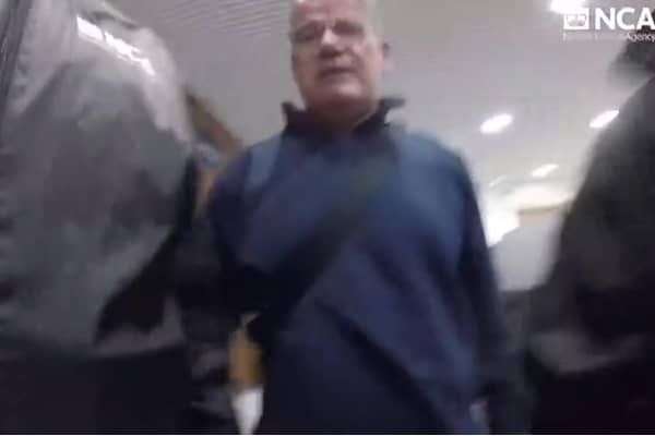 The moment Thomas Bomber Kavanagh is arrested at Birmingham Airport