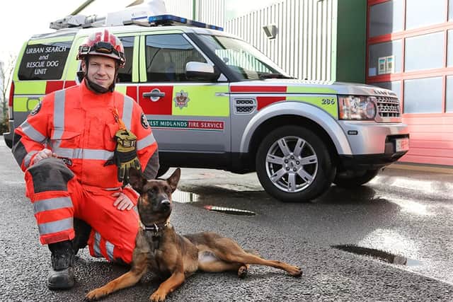 Firefighter and Dog Handler Mick Attwood with Urban Search and Rescue Dog Luna