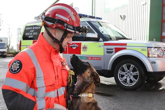 Firefighter and Dog Handler Mick Attwood with Urban Search and Rescue Dog Luna