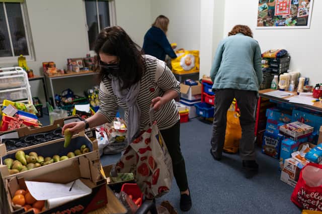 Volunteers are seen packing food parcels at a food bank (Photo by Peter Summers/Getty Images)