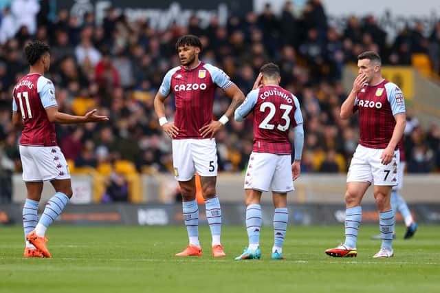 Ollie Watkins, Tyrone Mings, Philippe Coutinho and John McGinn of Aston Villa react during the Premier League match between Wolverhampton Wanderers and Aston Villa at Molineux