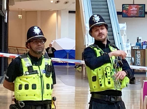 Police stand guard in front of forensics tent in the Bullring shopping centre on April 5, 2022