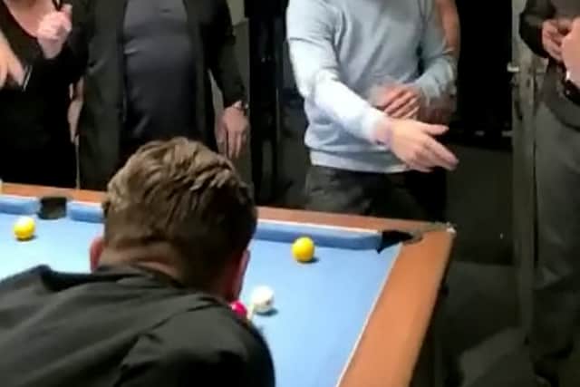 Ed Sheeran joins pub-goers for a game of pool at The Roost in Small Heath 