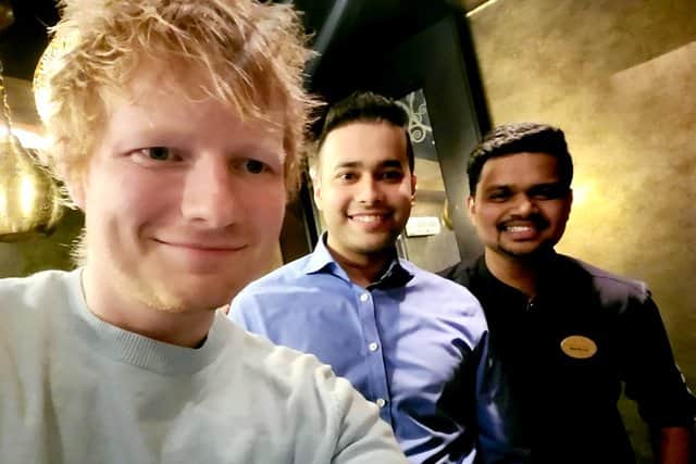 Ed Sheeran visited Asha’s curry house in Birmingham on Sunday. Pictured: Asha’s Birmingham manager Nouman Farooqui (centre) and staff members (right)
