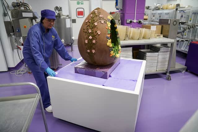Cadbury World chocolatier Dawn Jenks moves the Easter-themed chocolate creation at Cadbury World in Birmingham