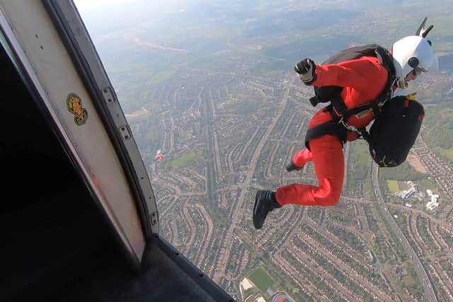 Members of the British Army parachute display team swooped into the Commonwealth Games stadium in Perry Barr, Birmingham.