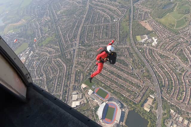 Members of the British Army parachute display team swooped into the Commonwealth Games stadium in Perry Barr, Birmingham.