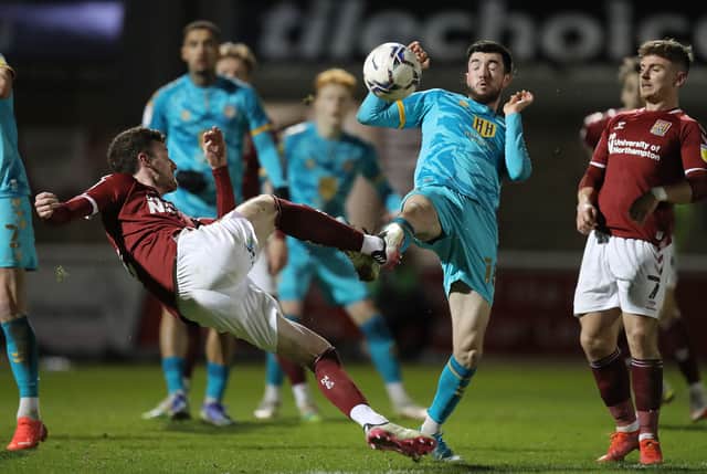 Paul Lewis of Northampton Town contests the ball with Finn Azaz of Newport County during the Sky Bet League Two match between Northampton Town and Newport County