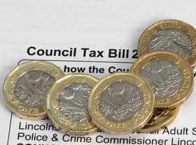 New pound coins on a council tax bill