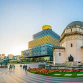 The sun shining over the Hall of Memory, Library of Birmingham and Baskerville house, England