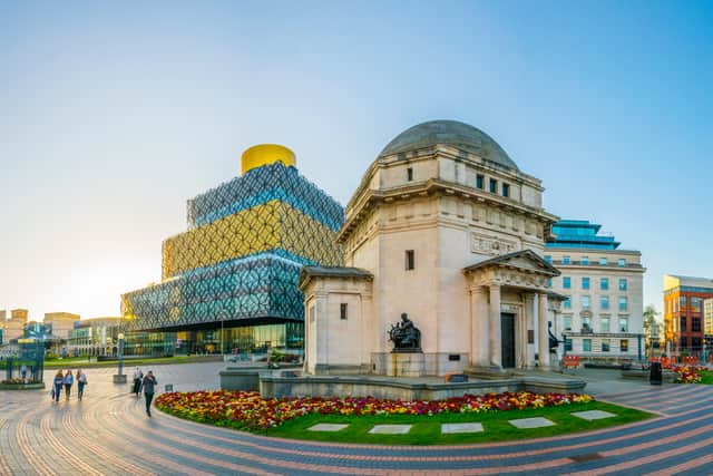 The sun shining over the Hall of Memory, Library of Birmingham and Baskerville house, England